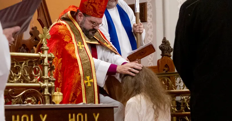 bishop cliff performing a confirmation ceremony